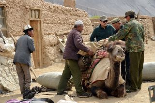 03 Loading A Camel In Yilik Village With Guide Muhammad, Camel Man And The Village Headman.jpg